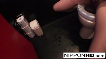 Japanese pornstar shows off her ass and tits in public restroom