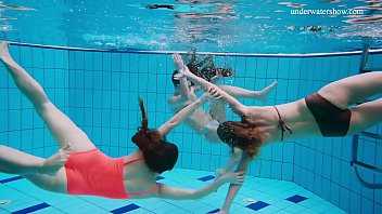 Lesbians in bikinis enjoy a wild threesome underwater